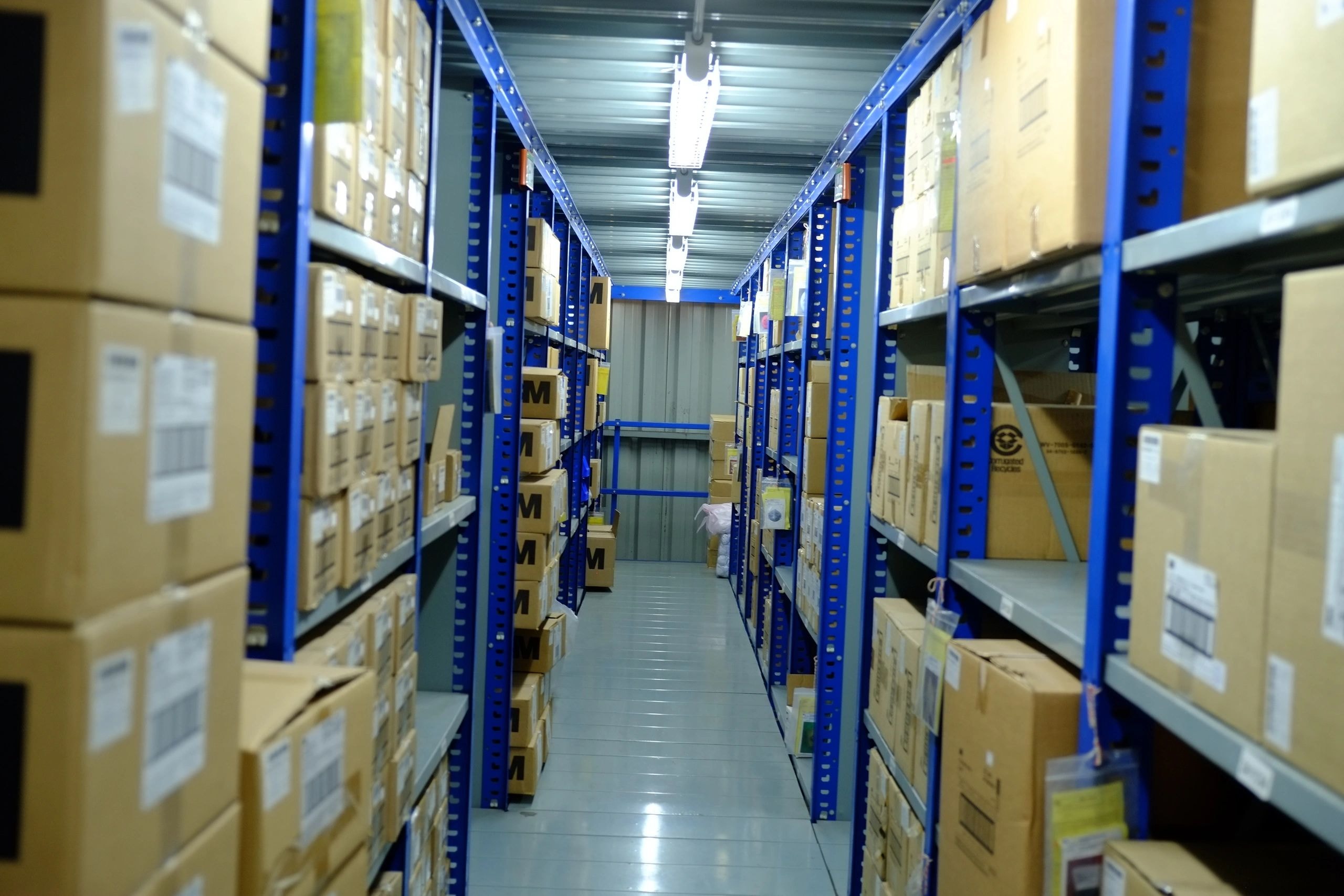 Warehouse interior with organized shelving rows